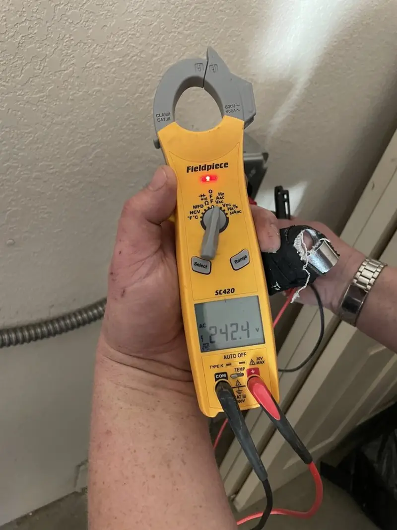 Voltage testing with clamp meter during Ceiling Fan Installation in Coffeyville